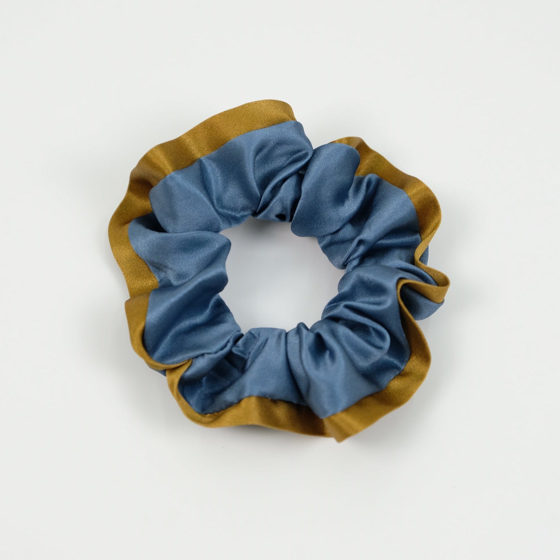 a Egyptian blue silk scrunchie with copper edge
