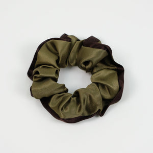 an olive green silk scrunchie with brown edge