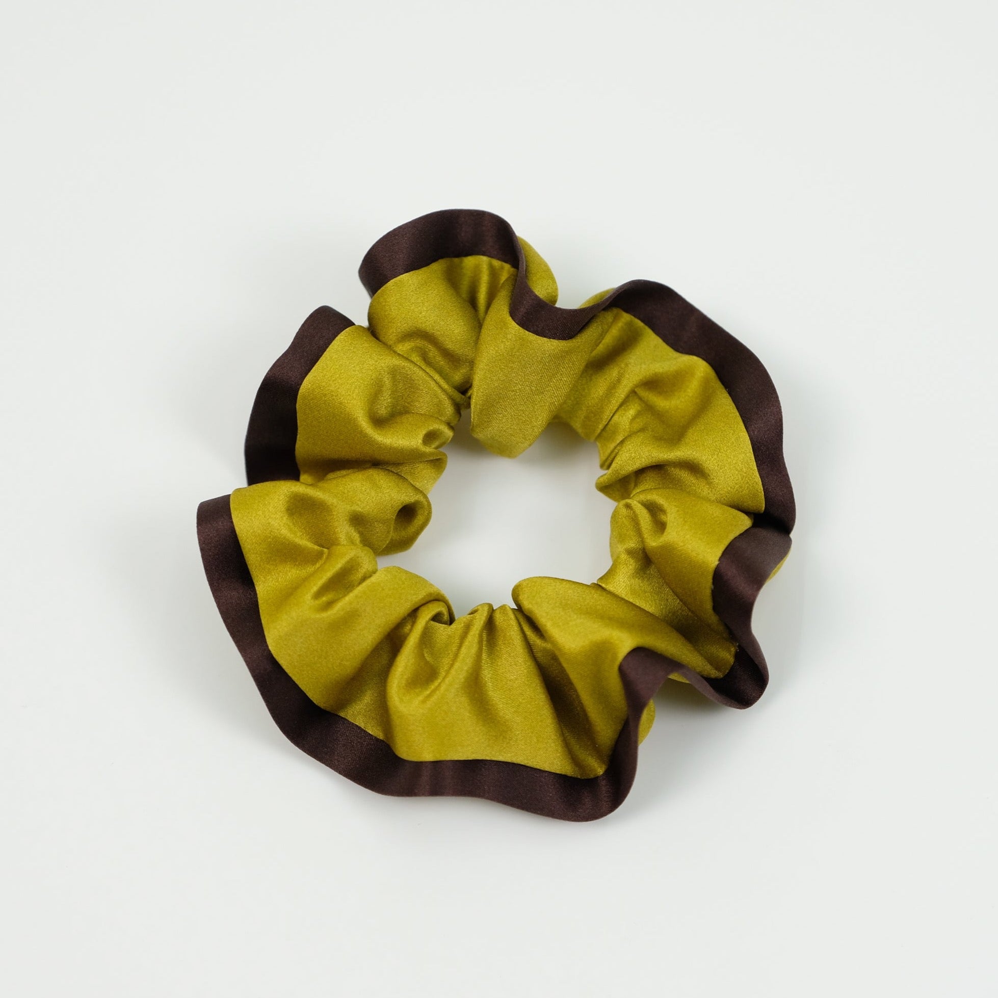 a mustard silk scrunchie with brown edge