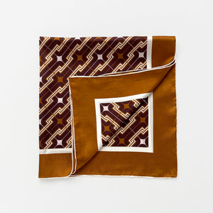 a luxury square silk scarf featuring vintage charm 70s style patten in burgundy, tan and beige palette with hand-rolled hems