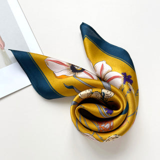 vintage vibe silk bandana scarf in vibrant mustard yellow featuring flowers and butterflies print with dark blue edge