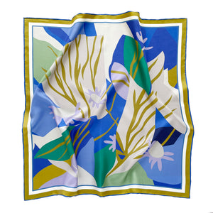 an abstract lotus print square silk scarf in blue, green, lilac and mustard yellow palette with hand-rolled hems