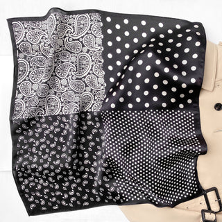 a black square silk scarf neckerchief featuring white paisley and polka dots pattern