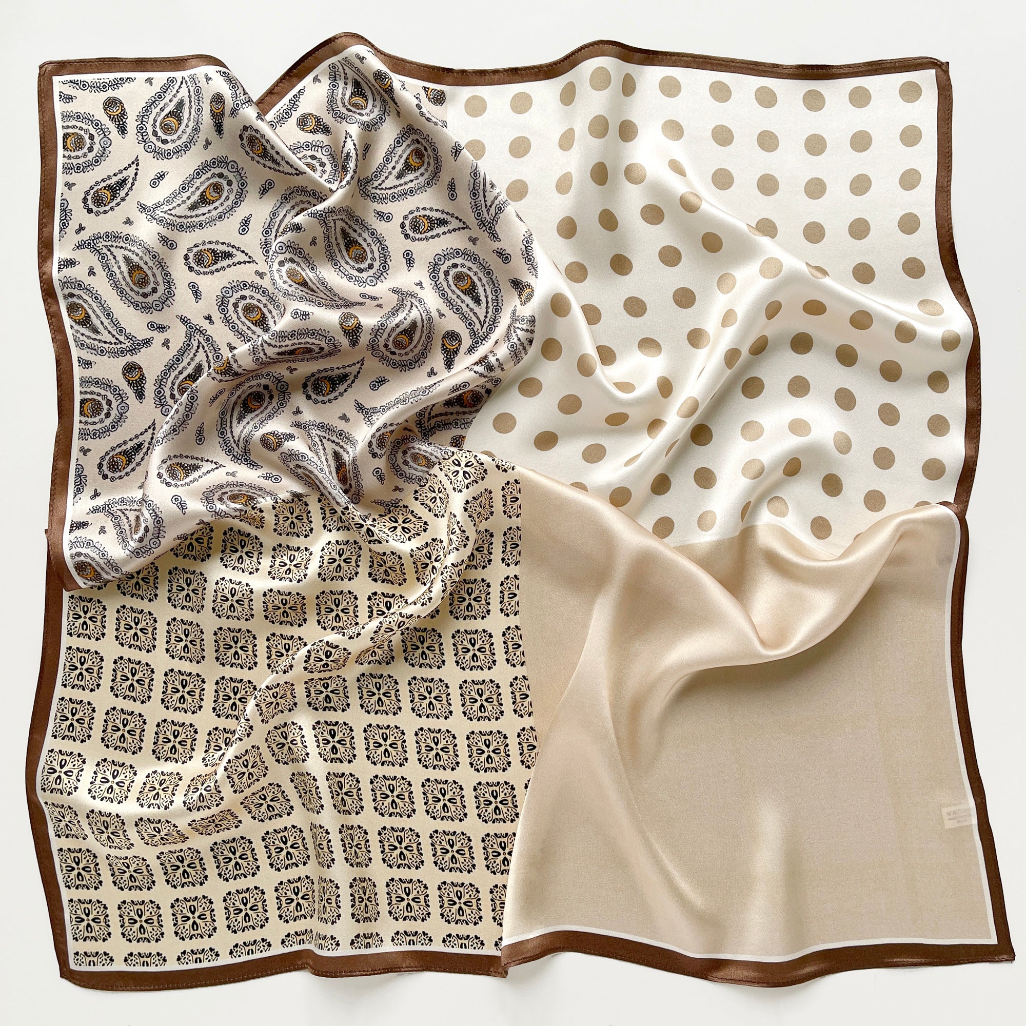 a beige and brown earth tones square silk scarf featuring bohemian paisley and polka dot prints with brown edges