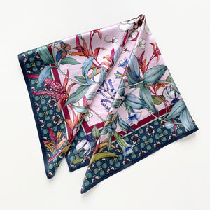 a pink base silk scarf featuring botanic floral print