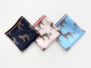 three luxury hand-rolled edges silk scarves featuring leopard print in black, pink and sky blue