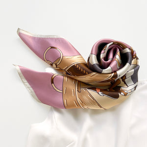 a pink silk scarf featuring acrobatic dancers print in elegant pink and beige brown hues, paired with a white dress