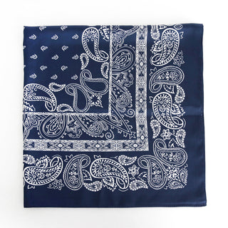 a navy blue square silk scarf featuring white paisley print 