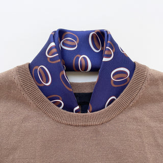 Indigo purple unisex silk bandana scarf with a circular pattern, made from 100% silk twill, featuring hand-rolled edges. The scarf measures 53x53cm and is designed for both men and women.