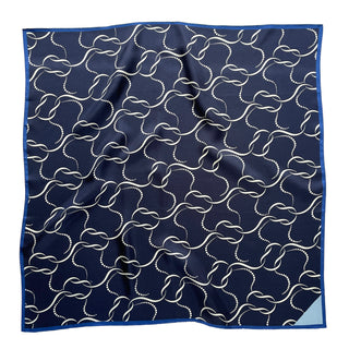 65x65 cm navy blue silk scarf with a geometric pattern and hand-rolled edges, designed for both men and women. The scarf features a smooth silk texture and is accented with elegant white wave-like lines, perfect for versatile styling.