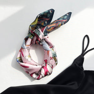 a botanic floral print silk scarf in pink and dark green palette
