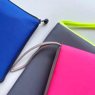 recycled iPad mini case/travel organizer in three different colours: blue, grey and neon pink