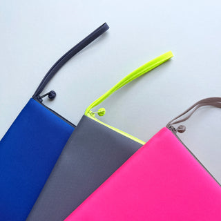 recycled iPad mini case/travel organizer in three different colours: blue, grey and neon pink