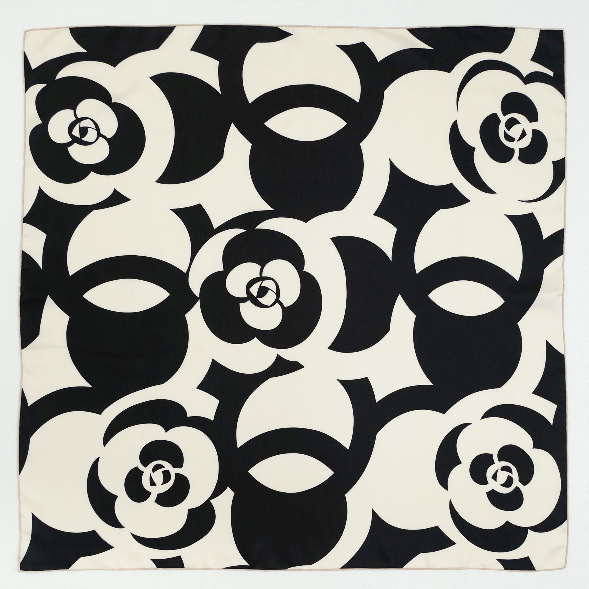 a black and white camellia print square silk scarf with  hand-rolled hems