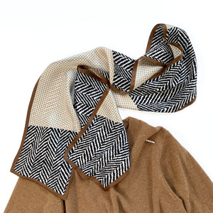 a houndstooth and zebra line pattern long silk scarf in beige, taupe and black palette palette