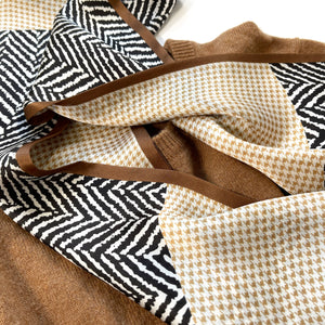 a houndstooth and zebra line pattern long silk scarf in beige, taupe and black palette palette