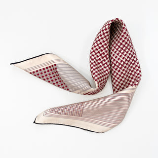 a deep red houndstooth pattern square silk scarf with hand-rolled hems