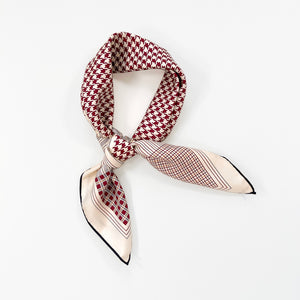 a deep red houndstooth pattern square silk scarf with hand-rolled hems