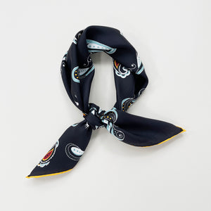 a black square silk scarf with boho paisley pattern and hand-rolled hems