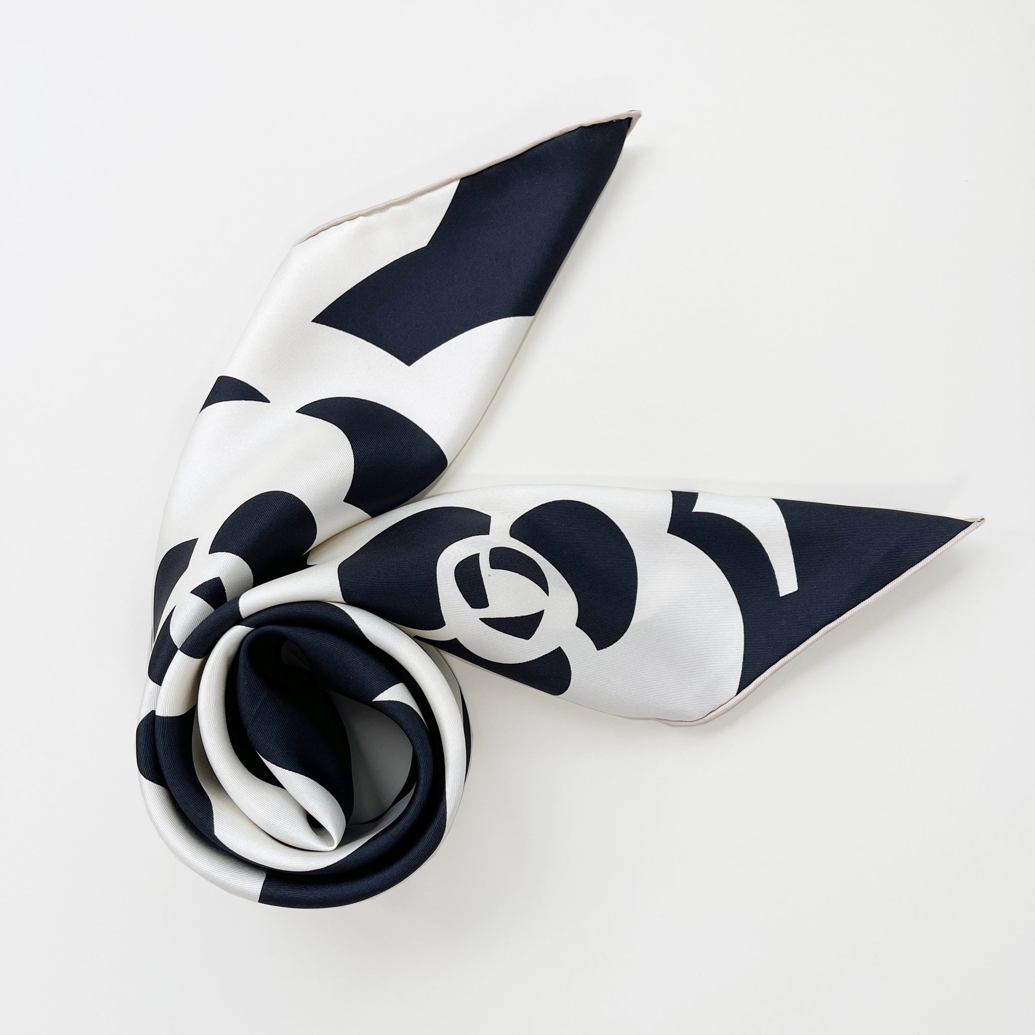 a luxury black and white camellia print large square silk scarf with hand-rolled hems