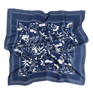 a rich blue square silk scarf suits for both women and men, featuring botanic leafy and flower print and hand-rolled hems 
