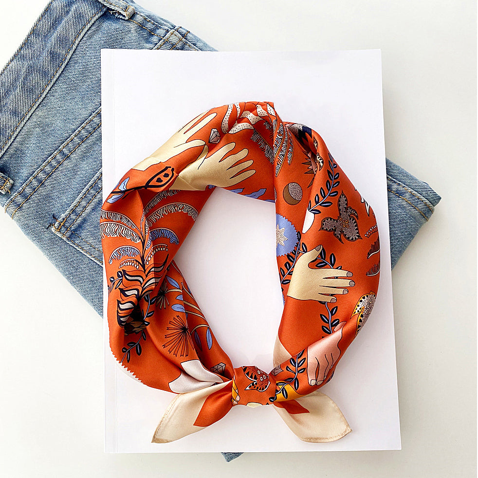 an orange small silk scarf/bandana/neckerchief with tarot print