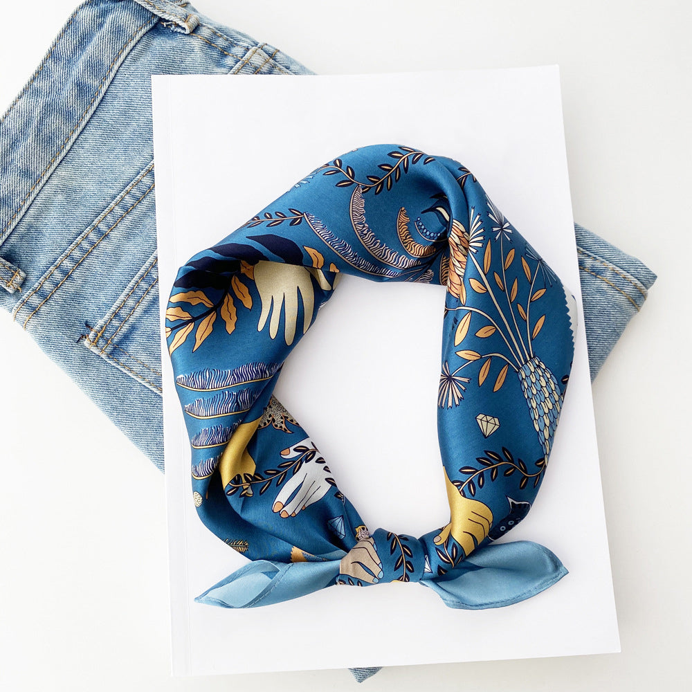 a dusty blue small silk scarf/bandana/neckerchief with tarot print