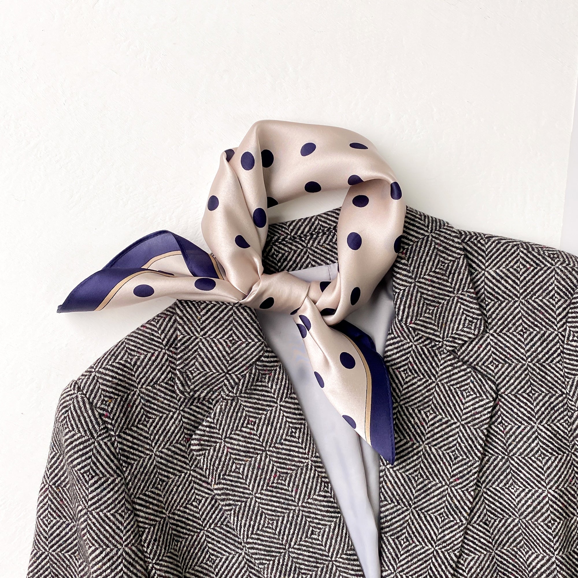 a champagne small silk scarf/neckerchief with polka dot pattern
