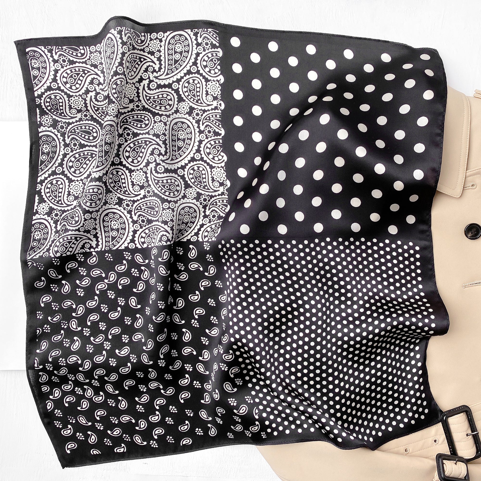 a black square silk scarf neckerchief featuring white paisley and polka dots pattern