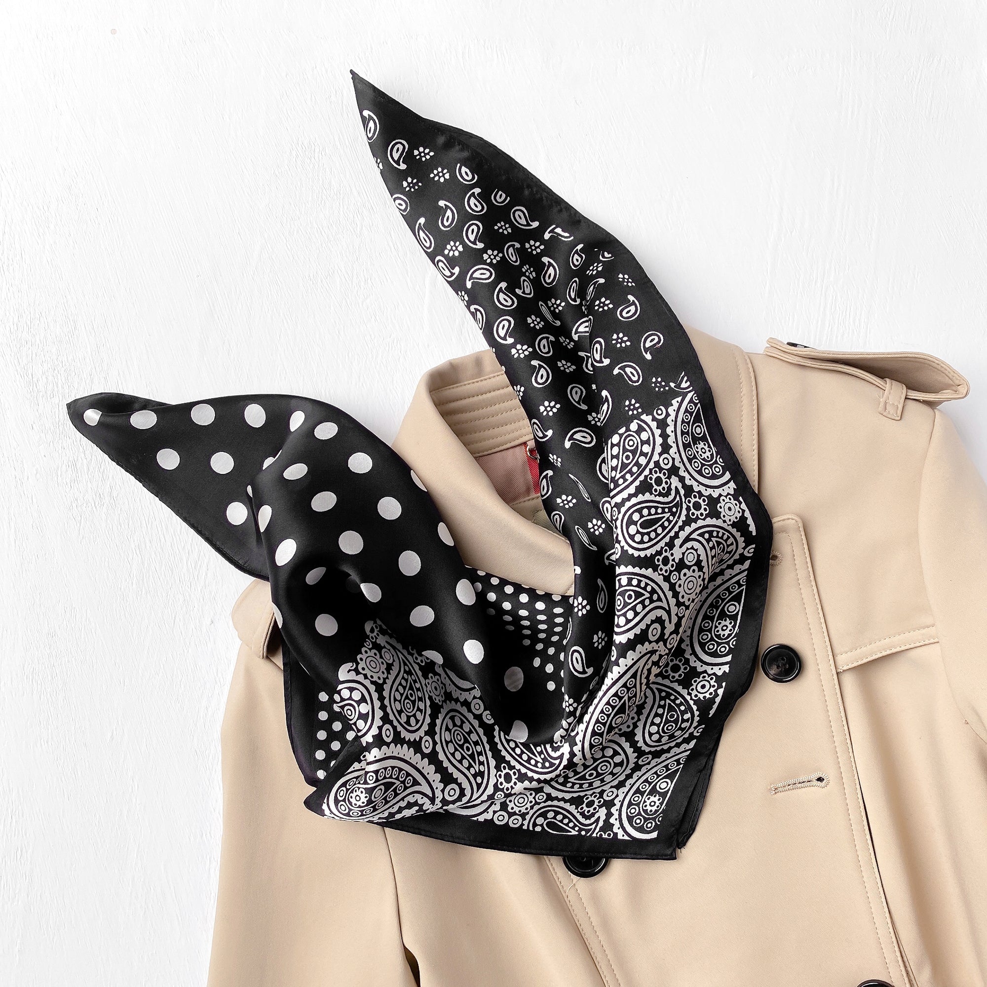 a black small silk scarf neckerchief with paisley and polka dots patterna black silk scarf neckerchief featuring paisley and polka dots pattern, paired with a khaki coat