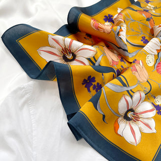 vintage vibe mustard yellow floral print small silk scarf/silk bandana/silk neckerchiefvintage vibe silk bandana scarf in vibrant mustard yellow featuring flowers and butterflies print with dark blue edge