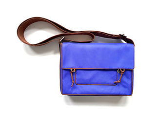 Recycled indigo blue preppy style messenger bag with brown strap