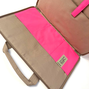 a recycled laptop briefcase in neon pink