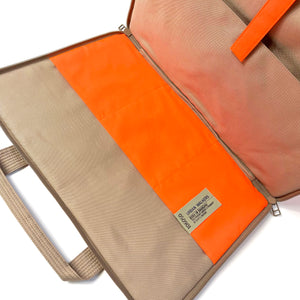 a recycled laptop briefcase in neon orange