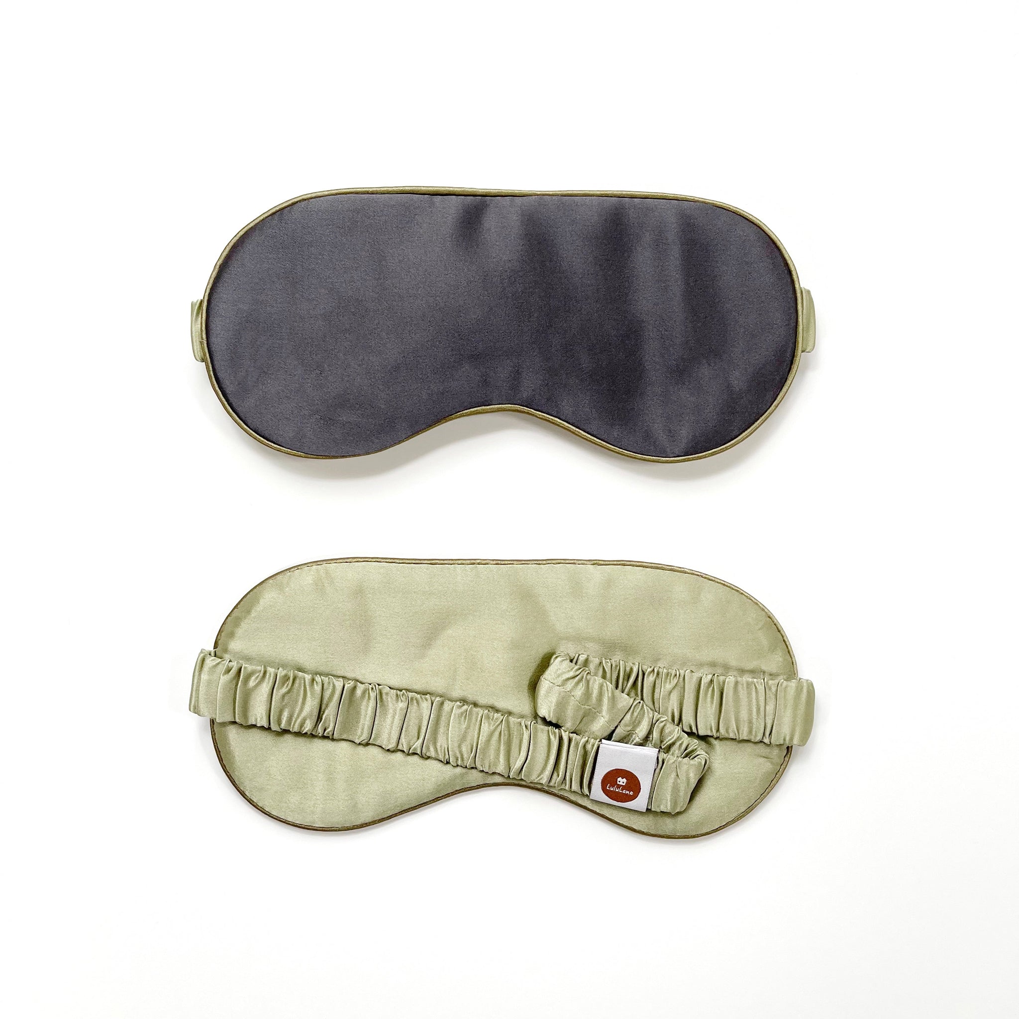 a dark grey silk eye mask with pea green strap and back side